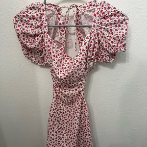 Beginning boutique open black white, pink, and red floral dress.